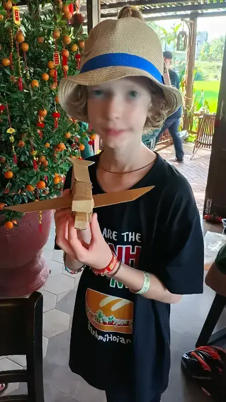 Child building a cardboard toy